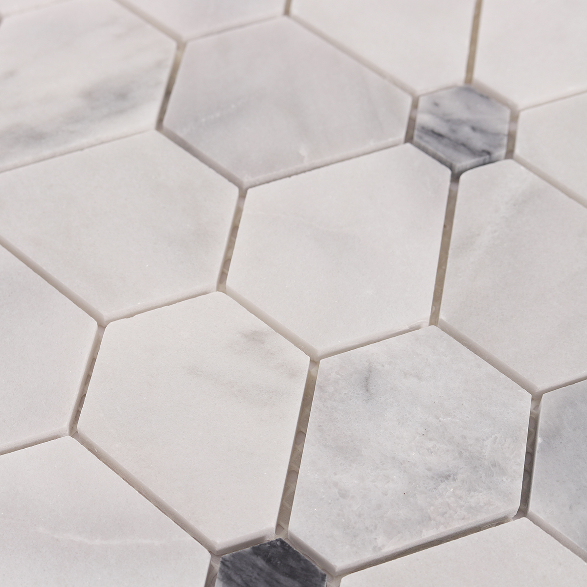 Detailed close-up of Carrara white hexagon flower marble mosaic tiles