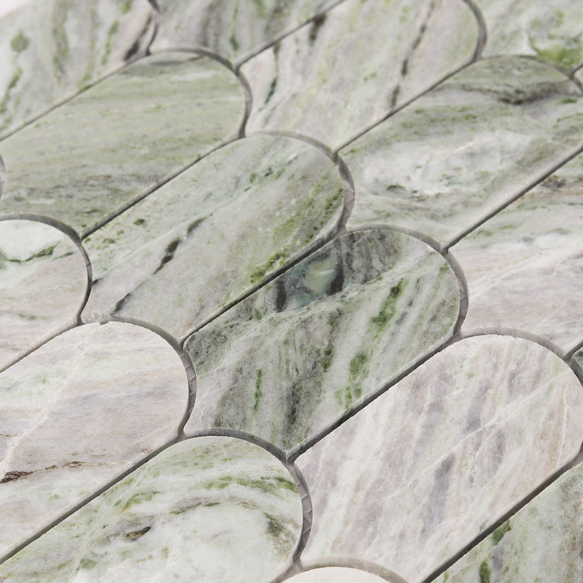 Close-up of Envy Green long fish scale marble mosaic tiles
