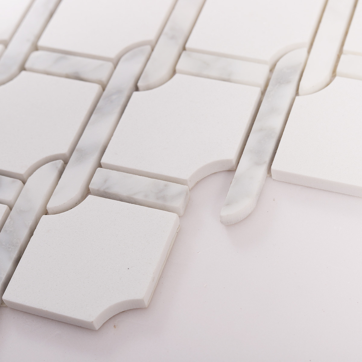 Side close-up view of White Fog Chain Link stone mosaic tiles, showing texture and thickness