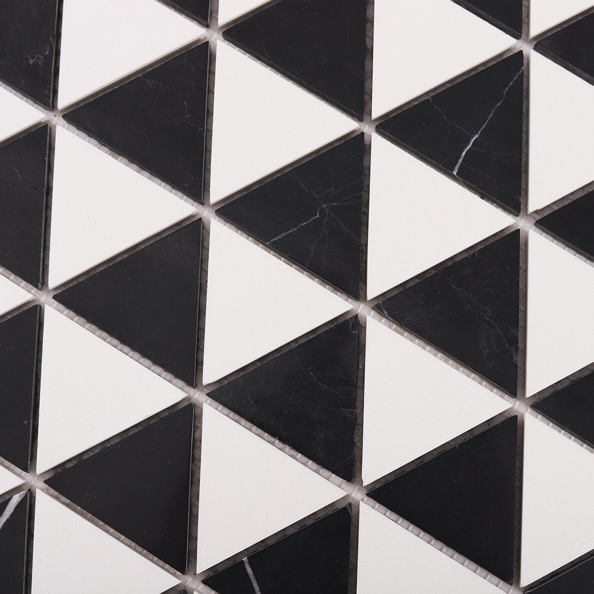 Close-up of White and Black Triangle Honed Stone Mosaic Tiles