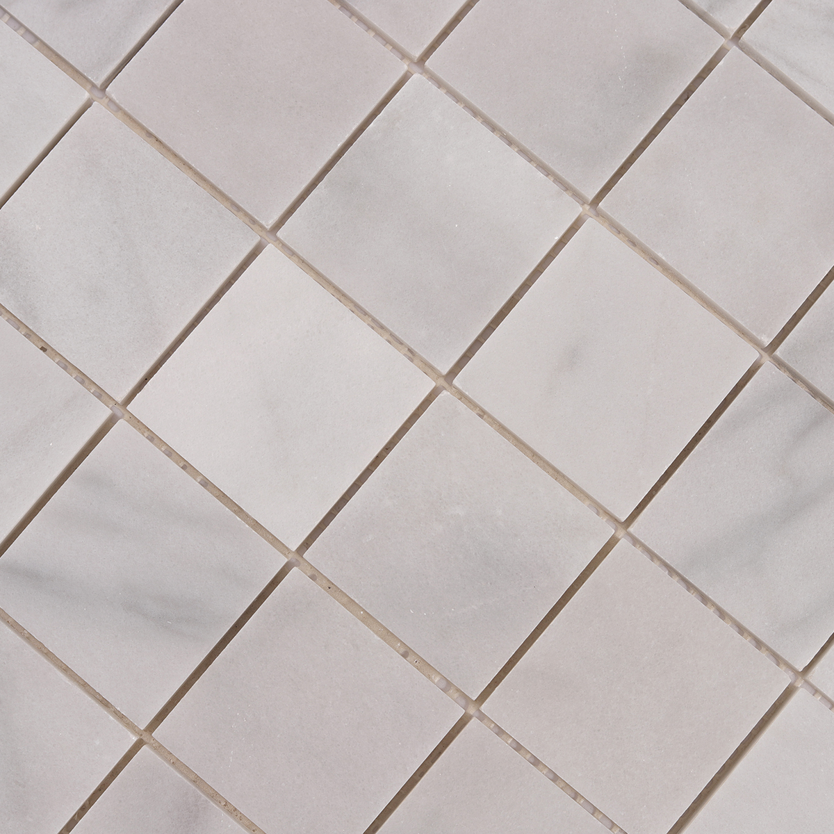 Detailed close-up of Carrara Venato Square Marble Mosaic Tiles