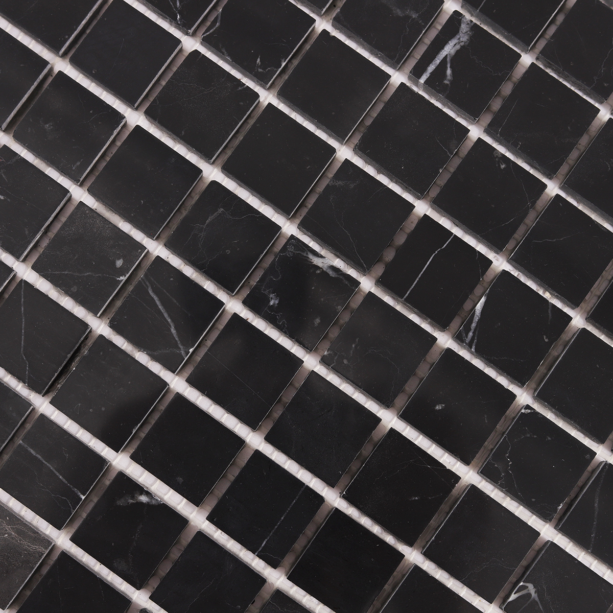 Close-up of Nero Marquina Square Black Polished Marble Mosaic Tiles.