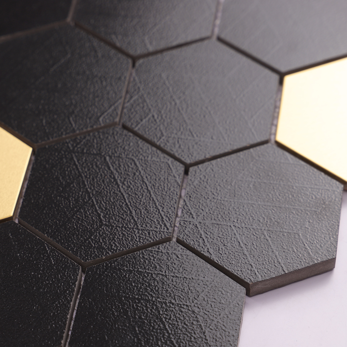 Side view close-up of Black and Gold Hexagon Ceramic Metal Mosaic Tile, edge detail