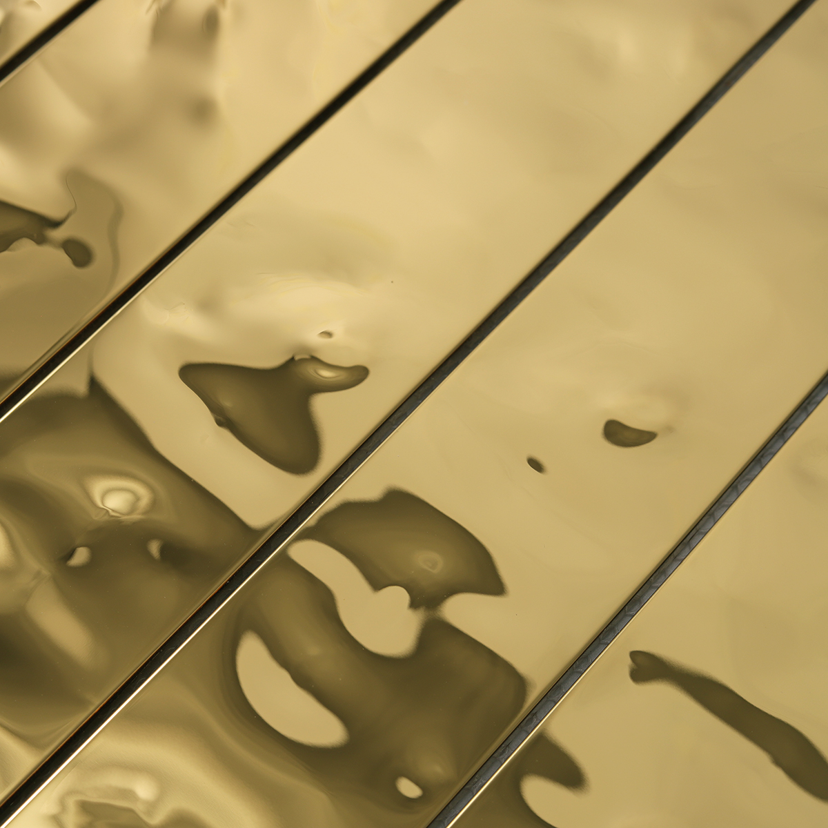 Close-up of Gold Wave Stainless Steel Brick Mosaic Tiles, texture detail