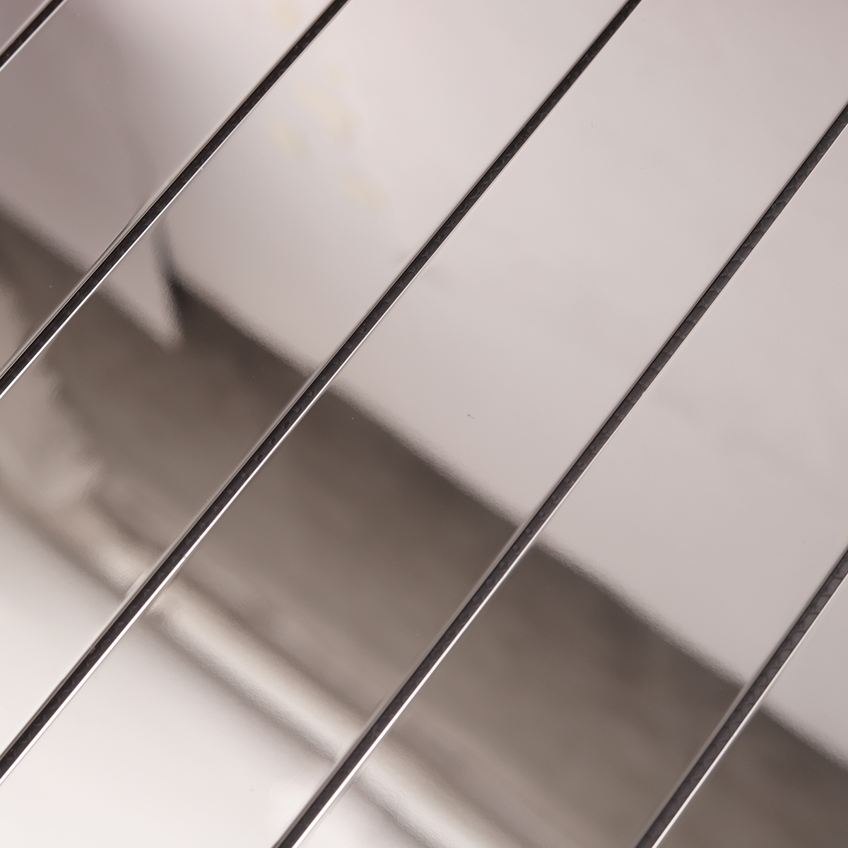 Close-up of Mirrored Rectangle Strip Metal Silver Mosaic Tiles, texture detail