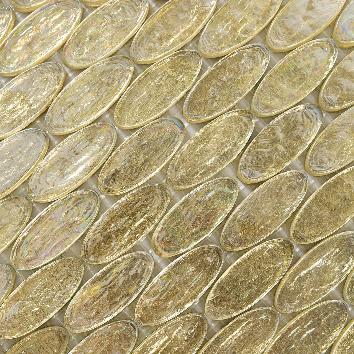 Close-up of Gold Foil Oval Glass Mosaic Tile, highlighting reflective foil texture