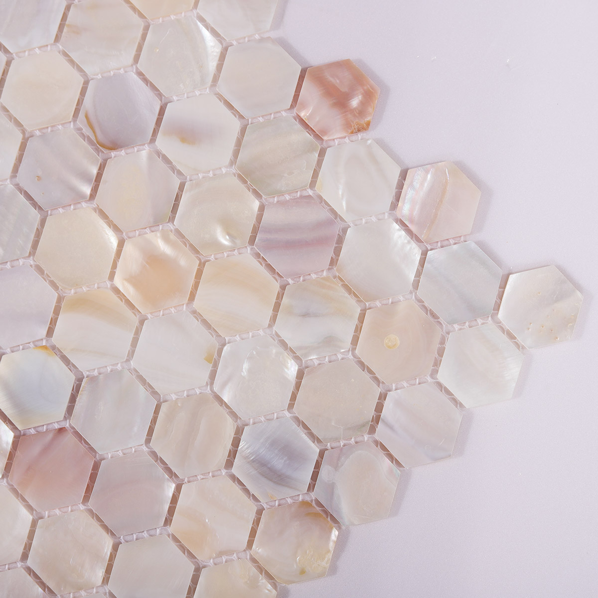 Side view close-up of Natural Mother of Pearl Hexagon Mosaic Tiles, clean edge detail visible.