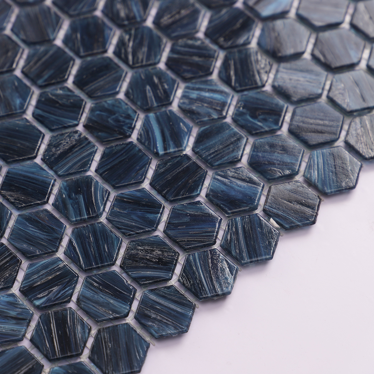 Side view close-up of Navy Blue Hexagon Glass Mosaic Tile, showcasing thickness