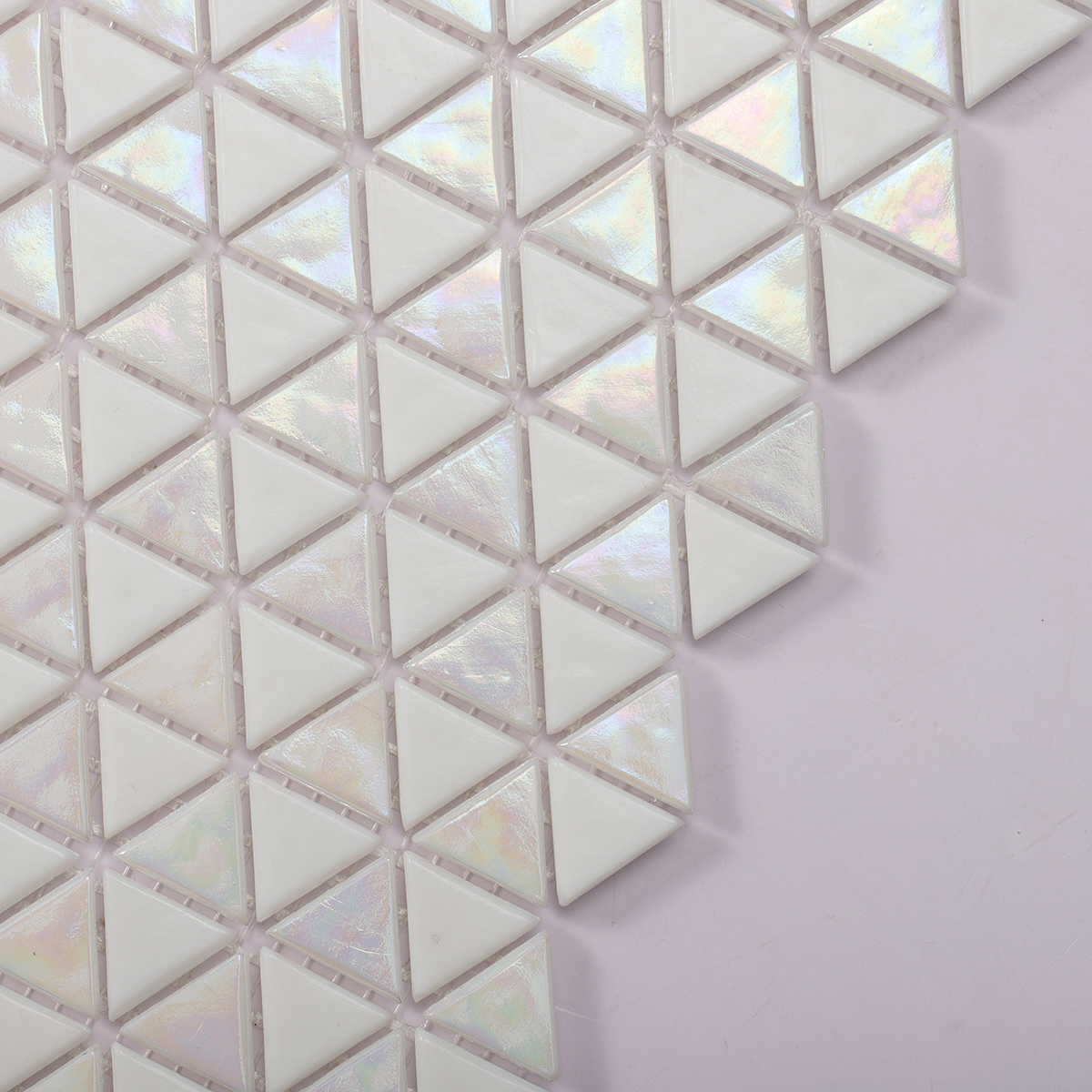 Side view close-up of Glossy Iridescent White Glass Triangle Mosaic Tile