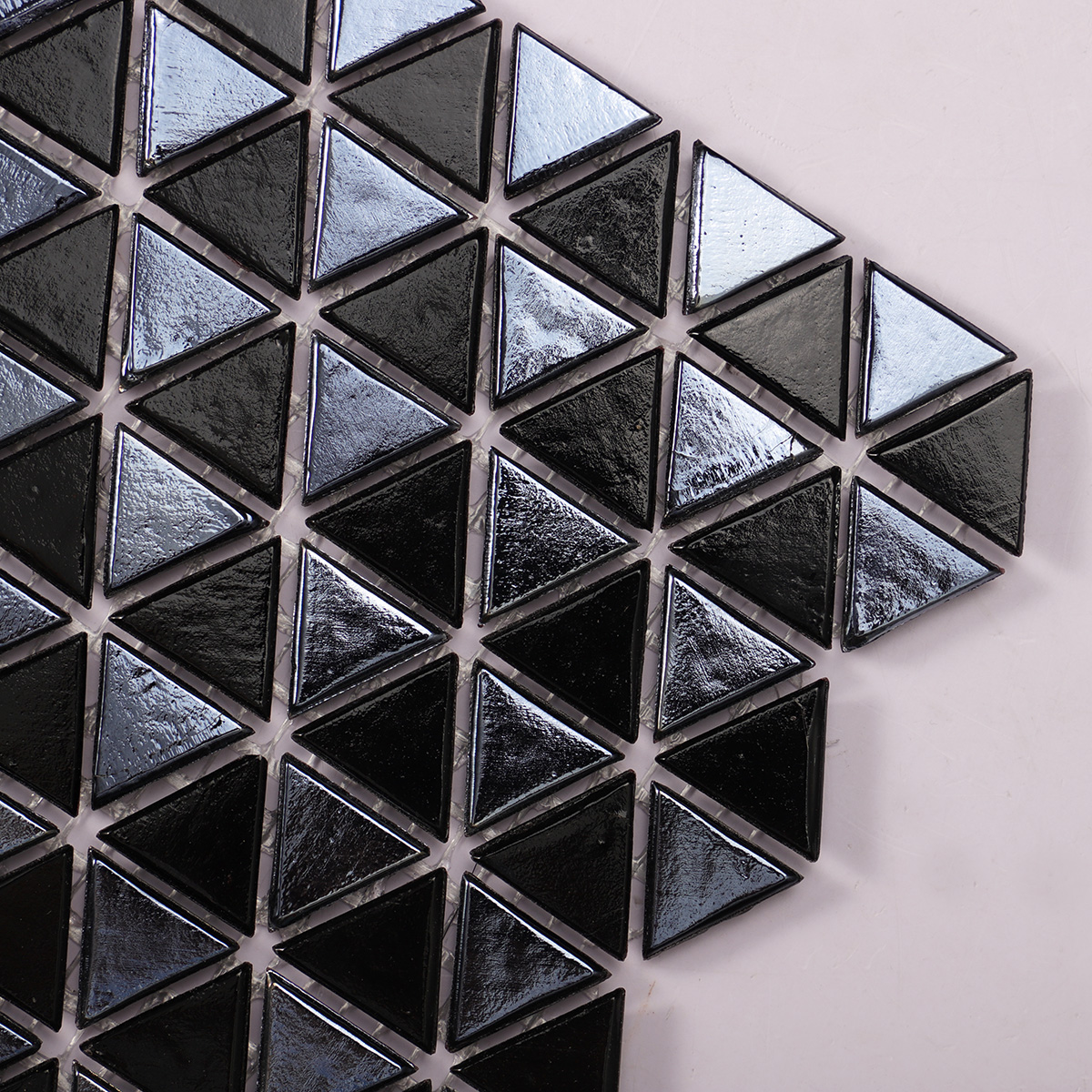 Detailed view of Glossy Mini Triangle Black Glass Mosaic Tile, showcasing reflective surface