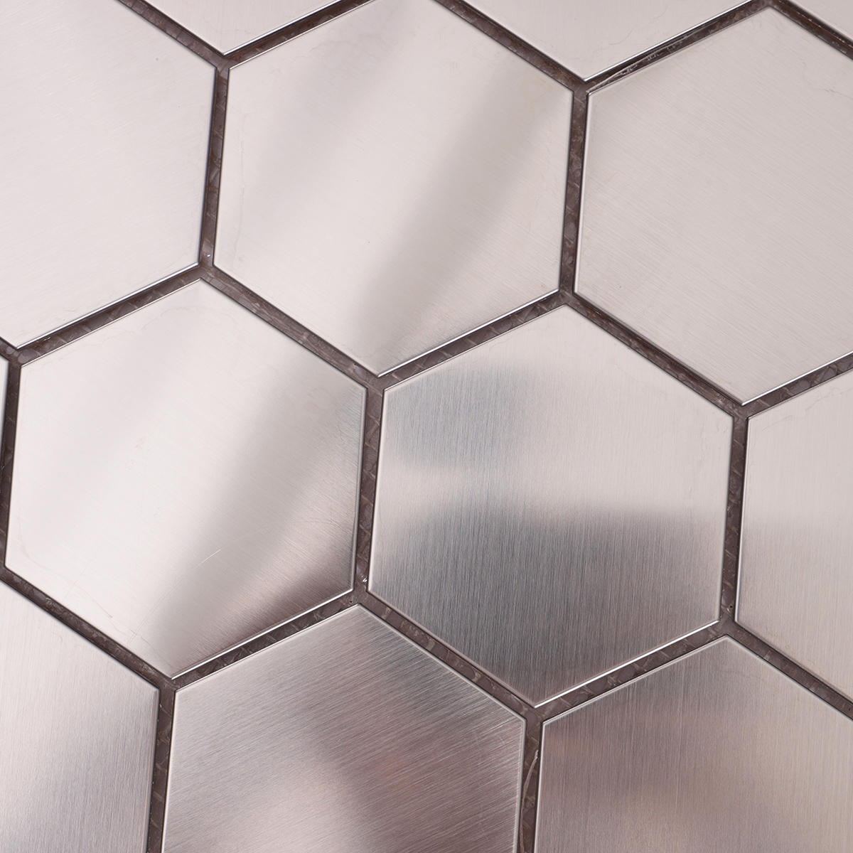 Close-up of Honeycomb Hexagon Silver Stainless Steel Brushed Metal Tile Surface