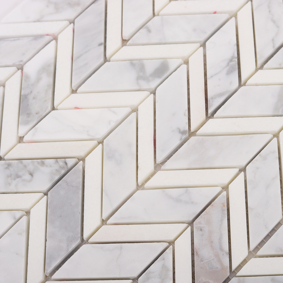 Detailed View of Carrara Marble Herringbone Tile Texture