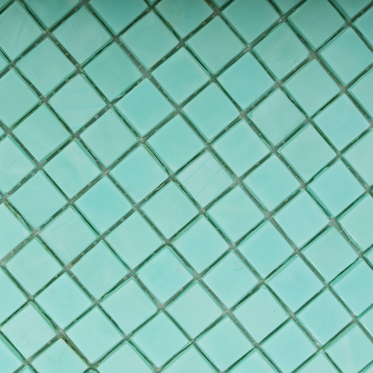 Close-up of Teal Square Glass Mosaic Tile Surface
