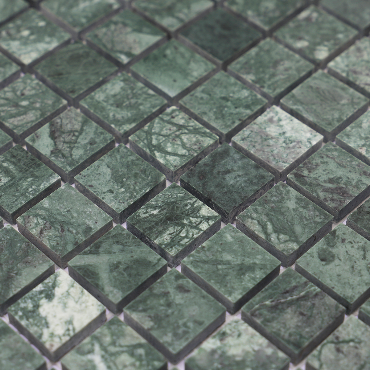 Detailed view of green marble square mosaic tiles, highlighting the unique marble texture.