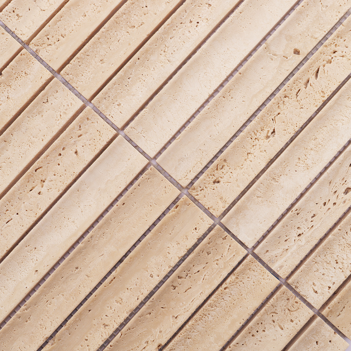 Close-up of beige travertine mosaic tiles with natural texture