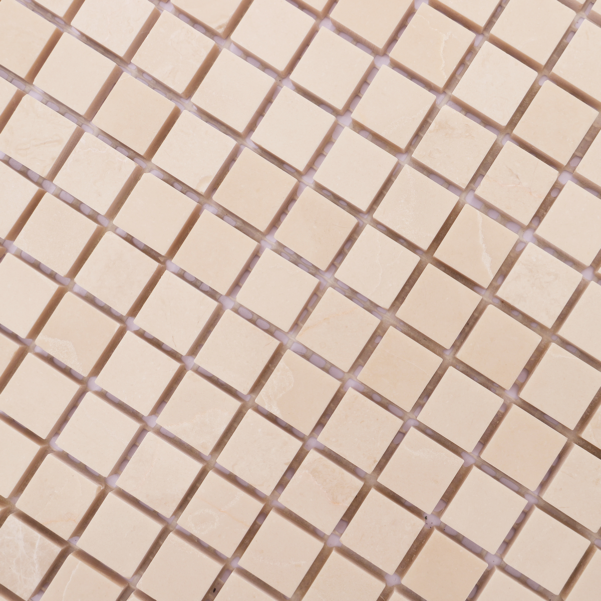 Detailed close-up highlighting the texture and sheen of beige polished marble tiles.