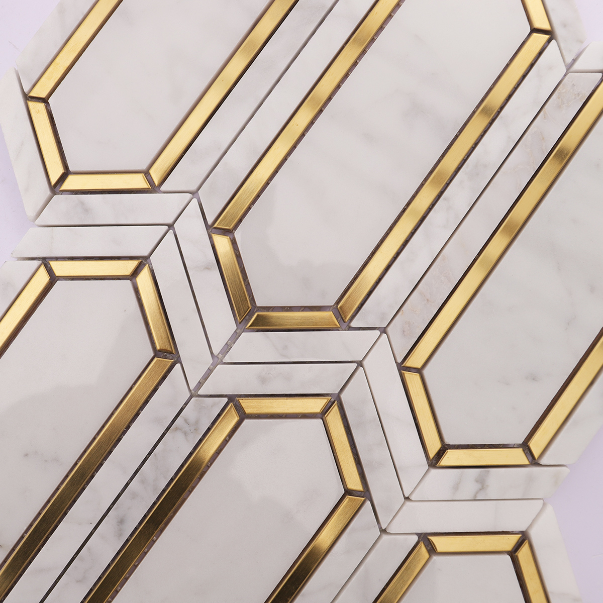 Detailed view highlighting the elegant combination of white marble and gold metal accents.