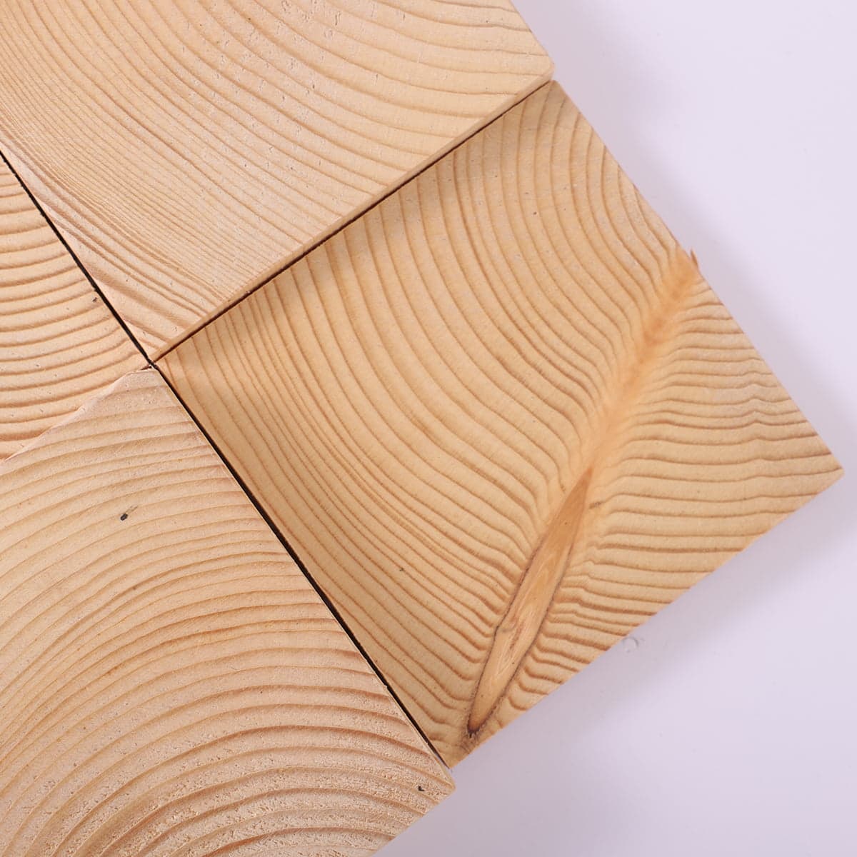 Corner detail of wood mosaic tile with curved wood grain