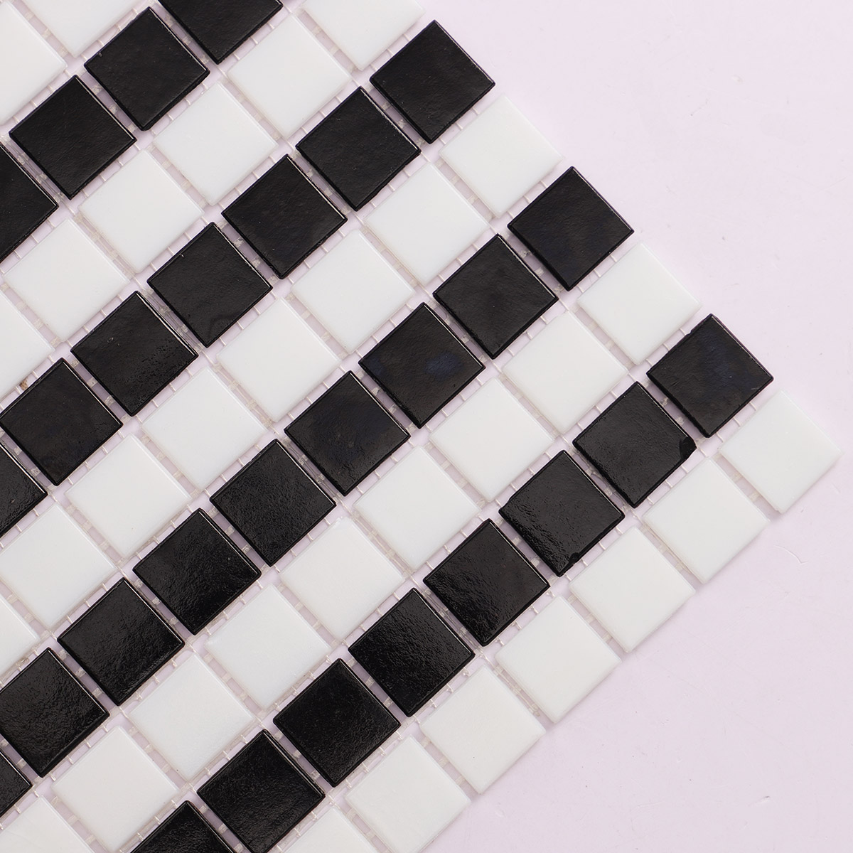 Detailed close-up of black and white stripe vintage glass mosaic tiles.