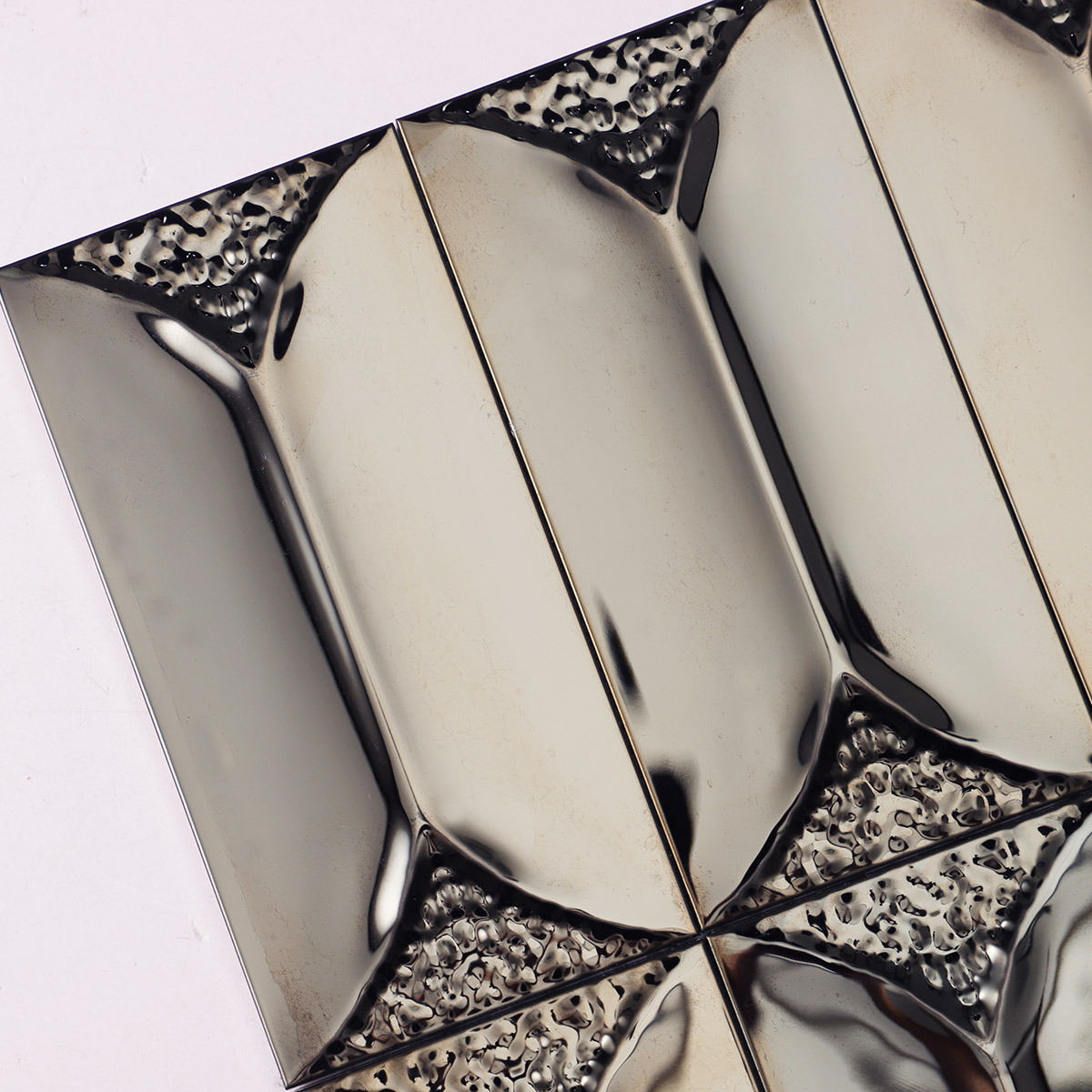 Macro close-up of 3D black mirror metal rectangle mosaic tiles.