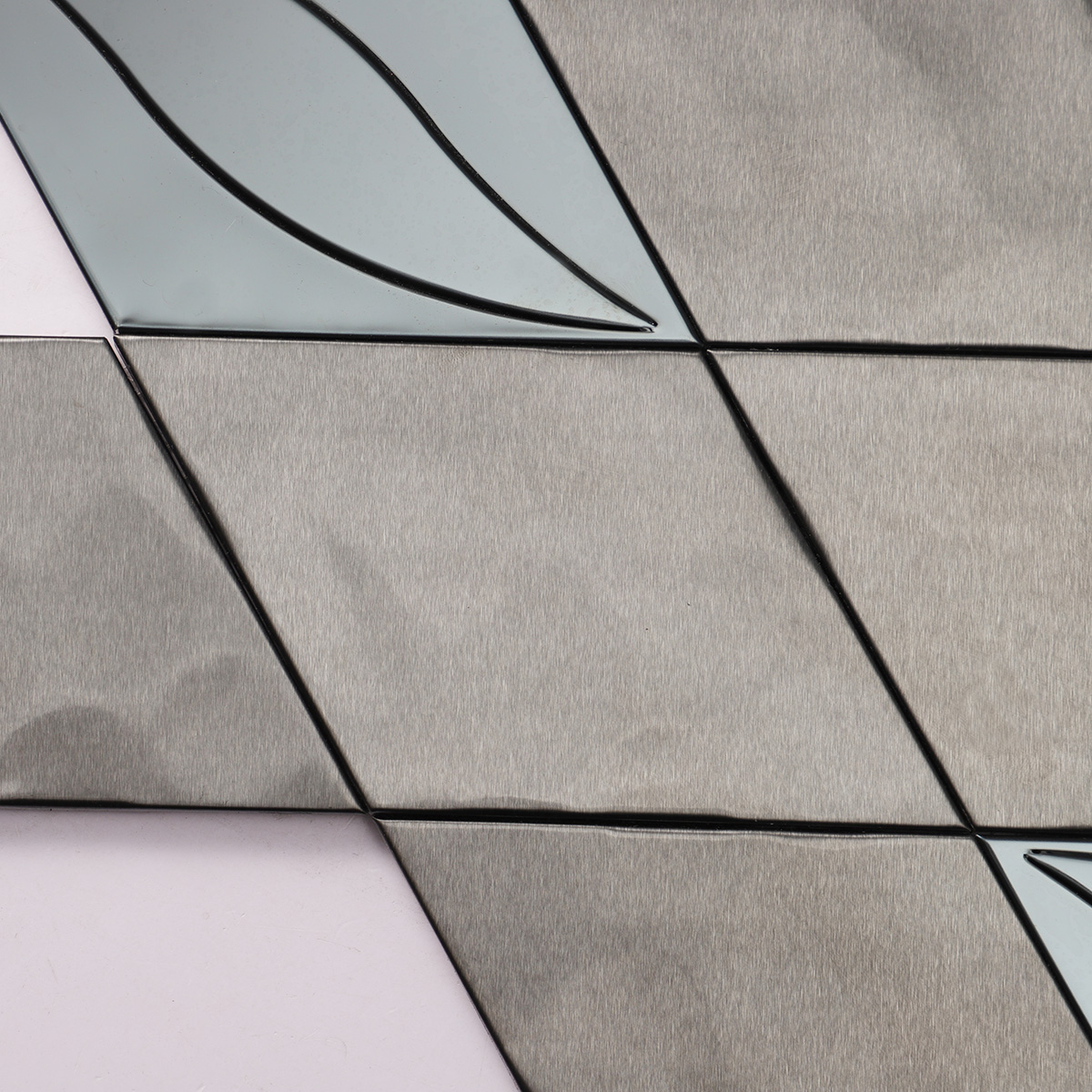 Texture close-up of black metal stainless steel diamond mosaic tiles.