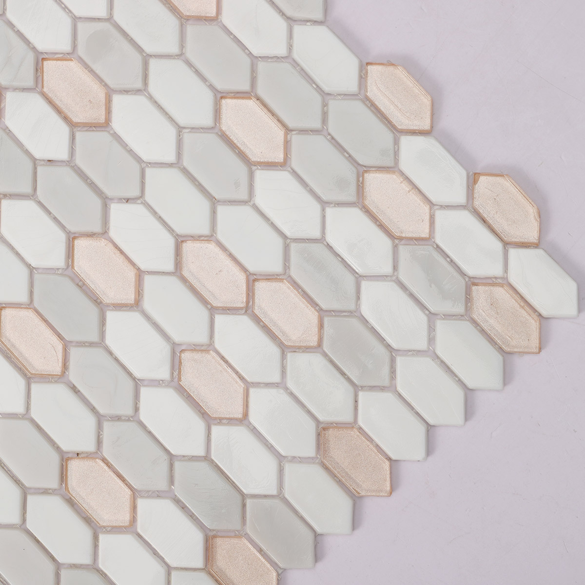 Detailed close-up of beige mixed fired earth glass mosaic picket tiles.
