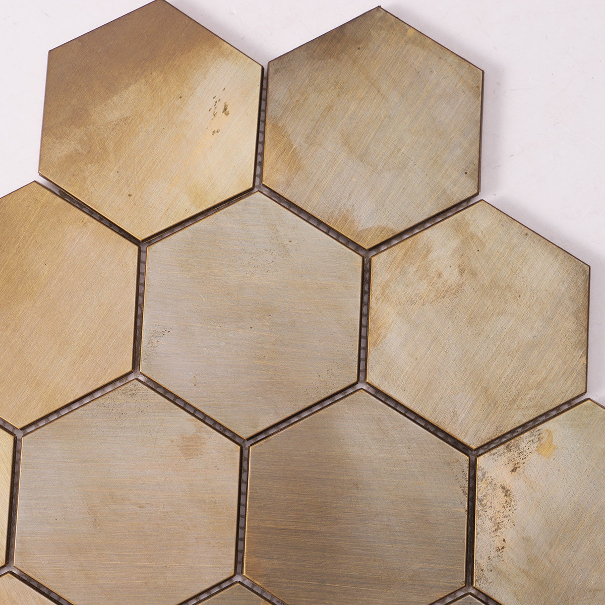 Close-up of copper hexagon mosaic wall tile