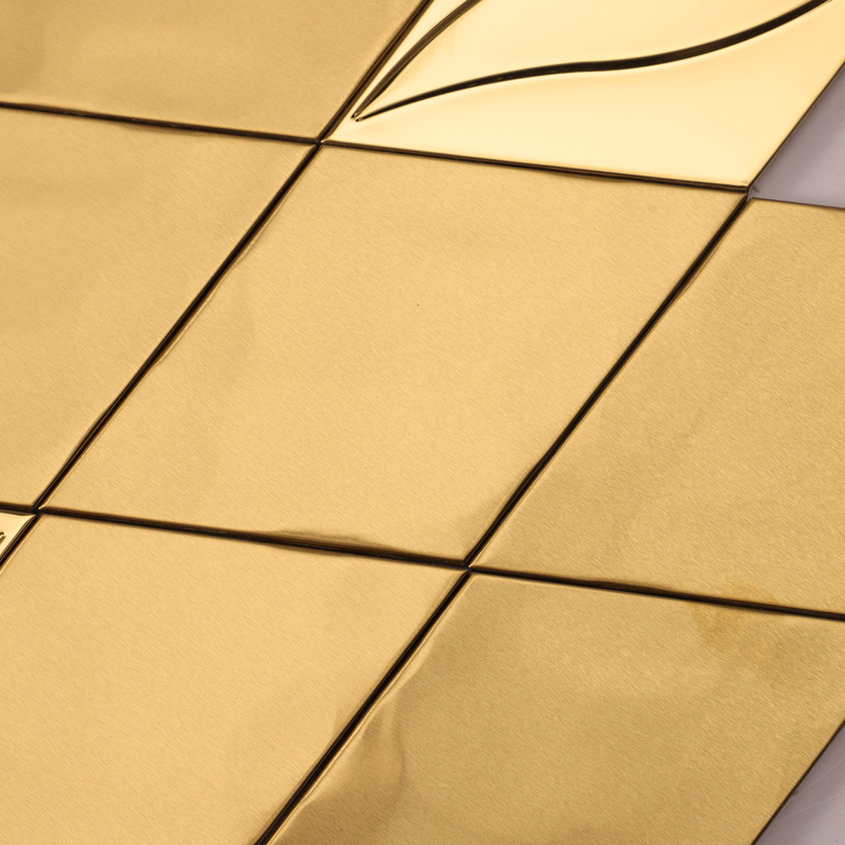 Close-up of the middle of 3D golden diamond stainless steel mosaic tiles