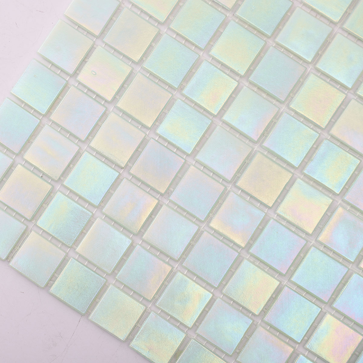 Second close-up of the side of green iridescent square glass mosaic tiles