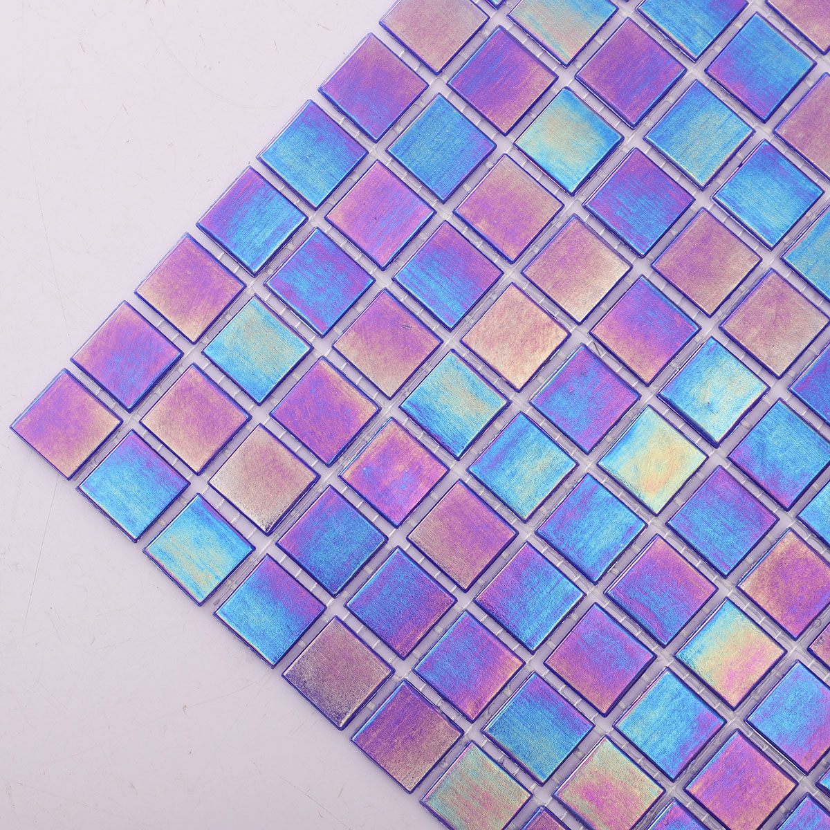 Close-up of the side of cobalt blue iridescent square glass mosaic tiles