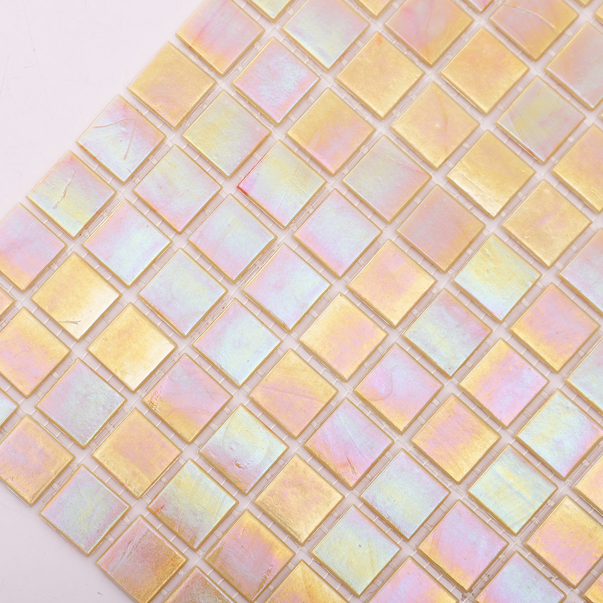 Close-up of pearlescent bright yellow square glass mosaic tiles