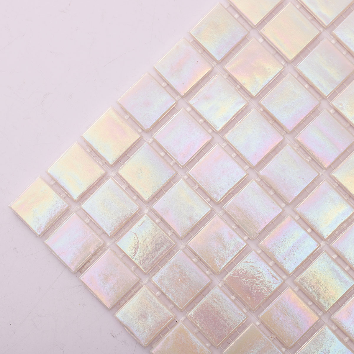 Close-up of pearly iridescent pink square glass mosaic