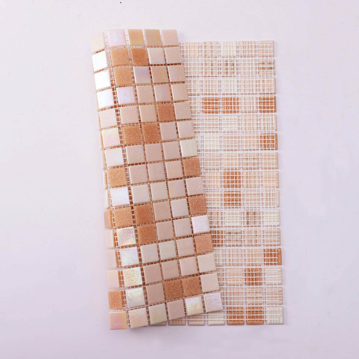Back side of light pink and yellow glass mosaic tiles, folded