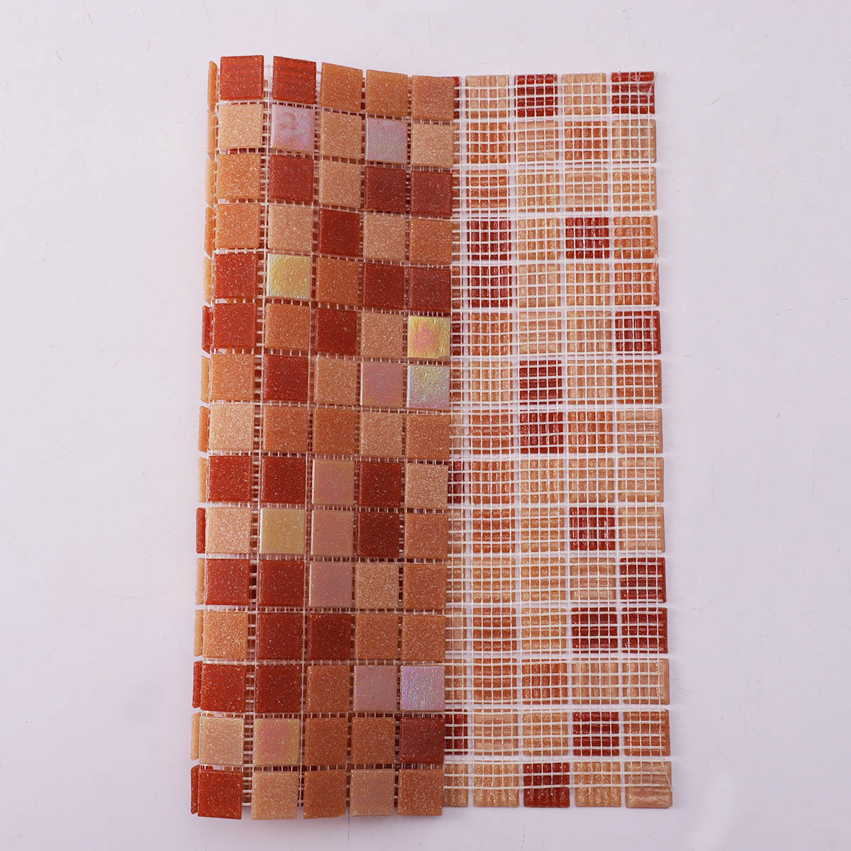 Folded back side of orange and yellow mixed glass mosaic tiles