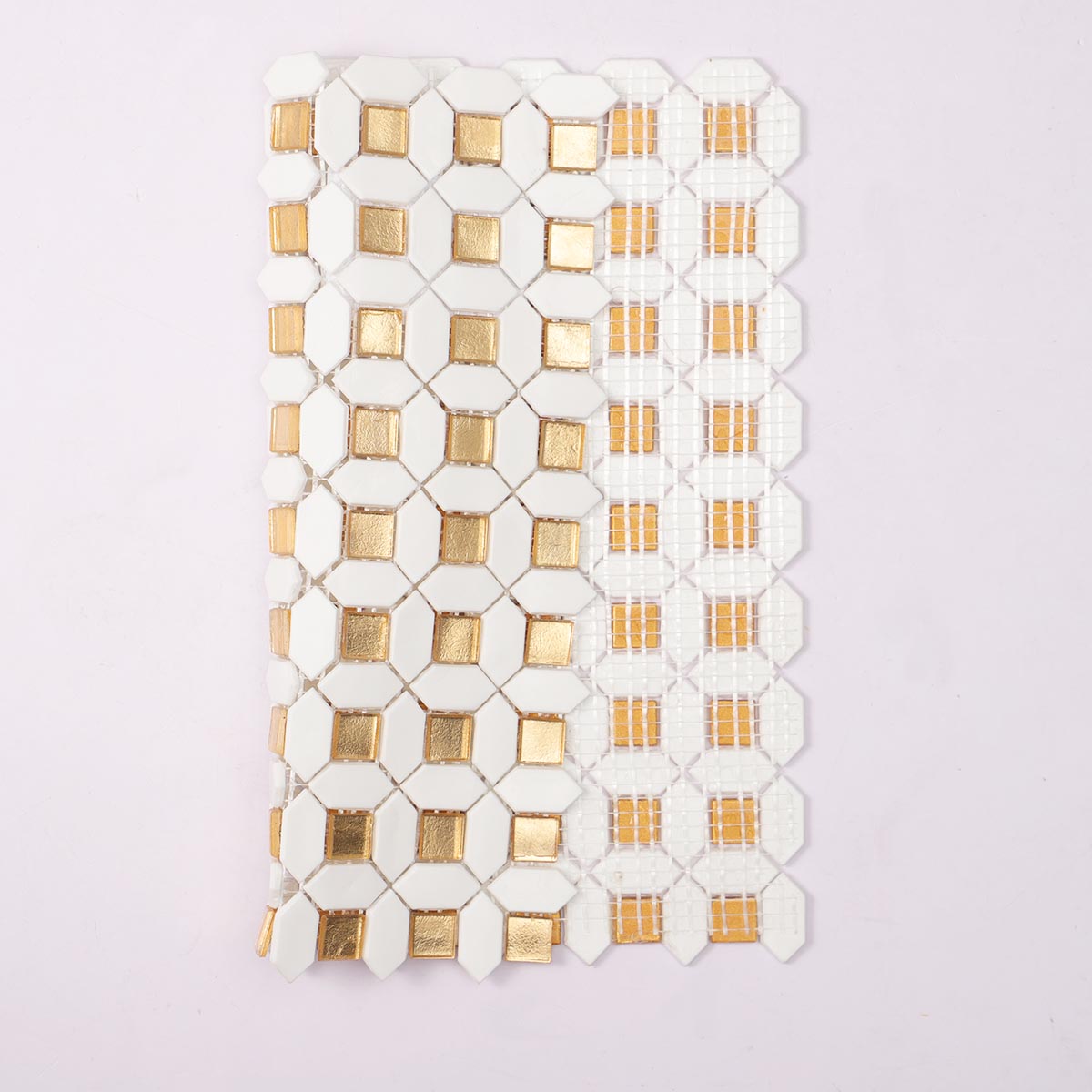 Folded view of back side of glossy gold and white glass mosaic tiles