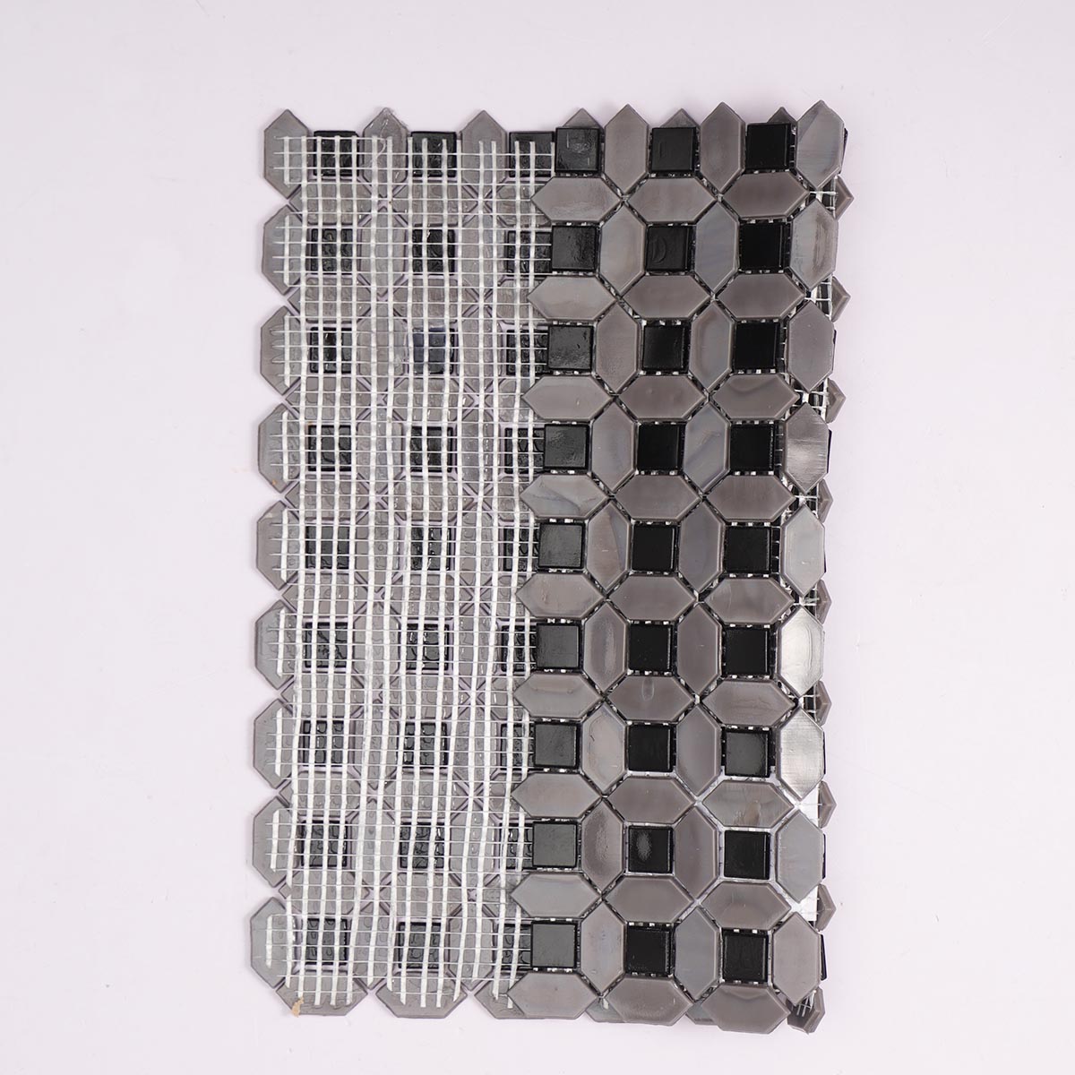 Gray picket and black square glass mosaic tiles folded back side