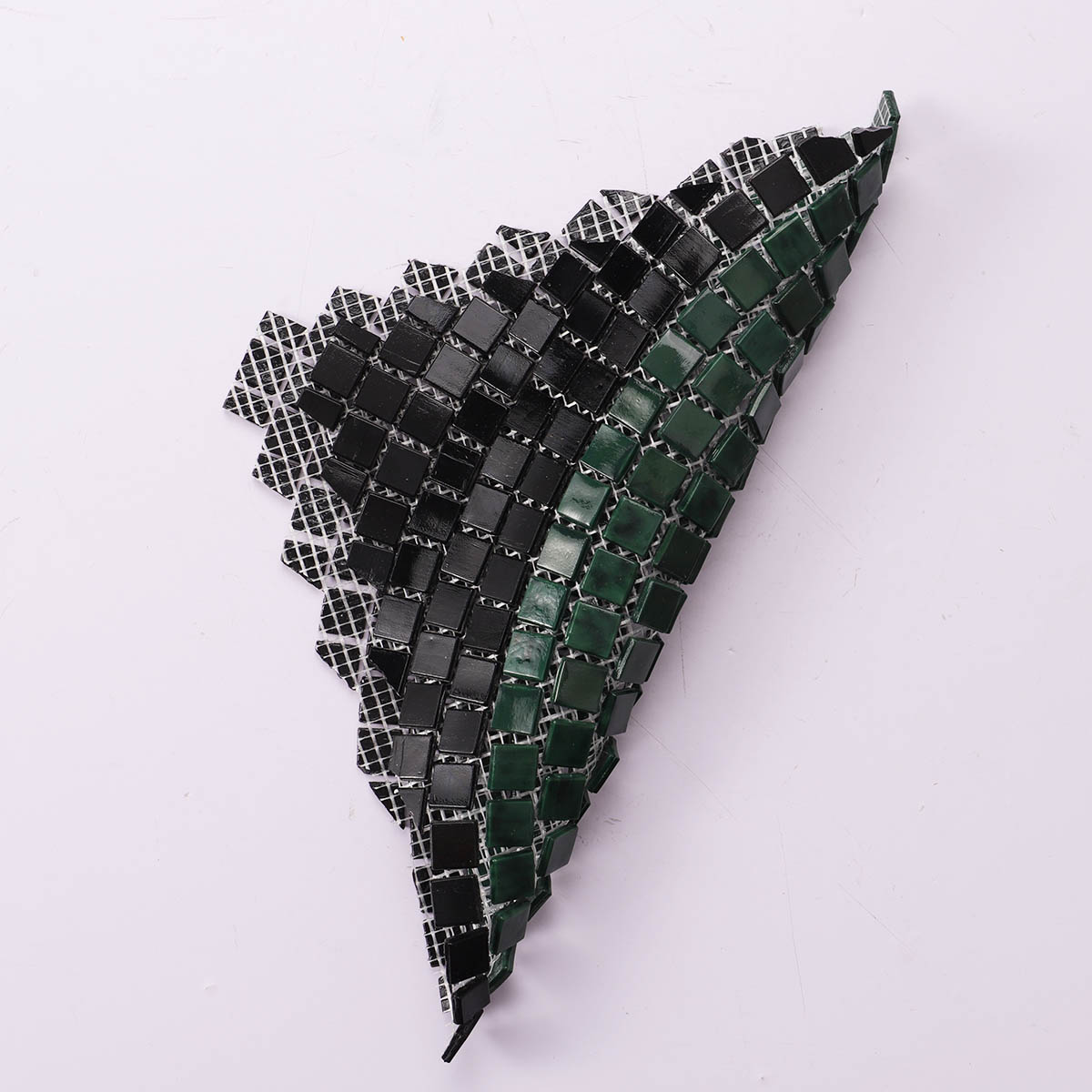 Folded view of back side of green and black glass mosaic pattern wall art