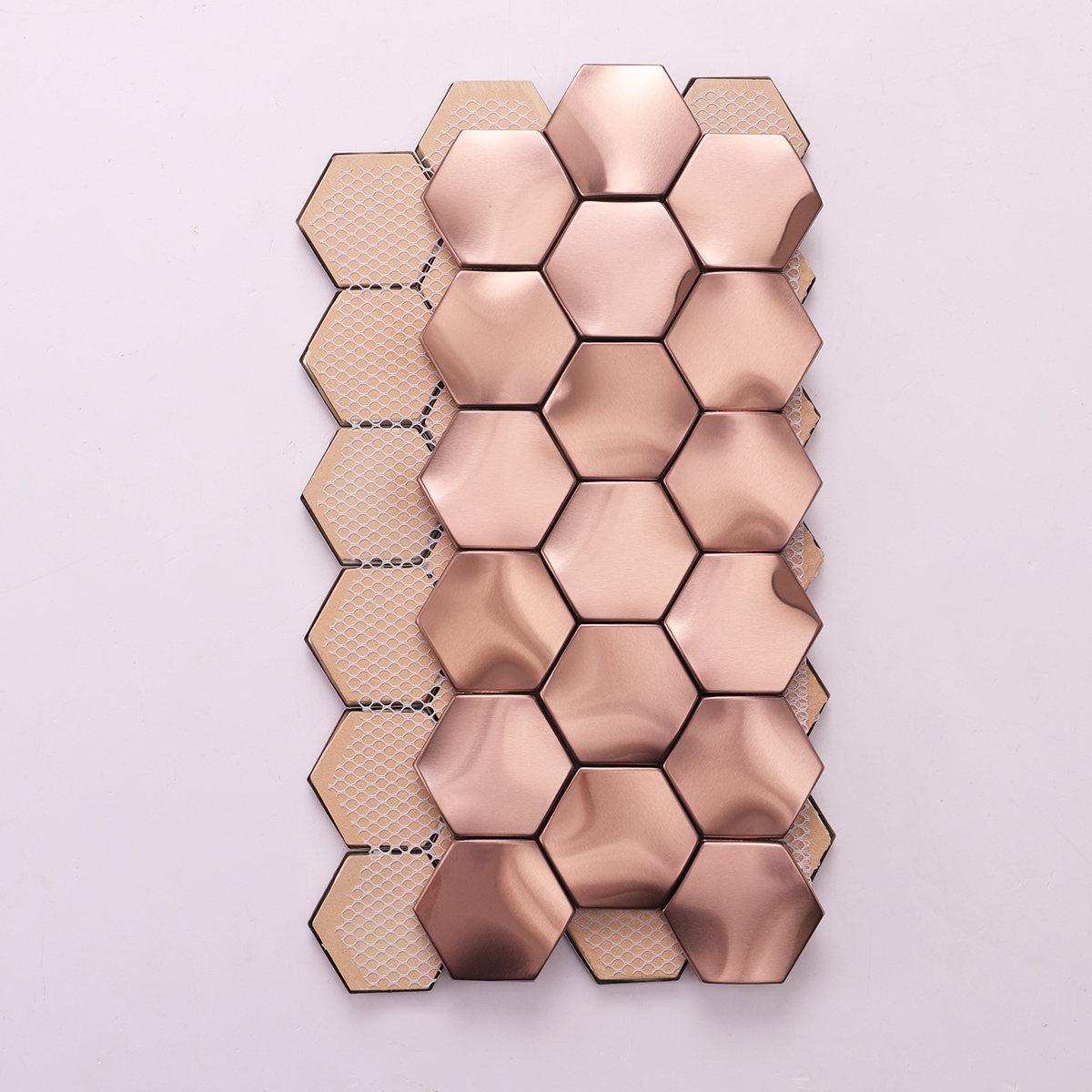 Back side of rose gold 3D hexagon stainless steel mosaic tiles, folded.