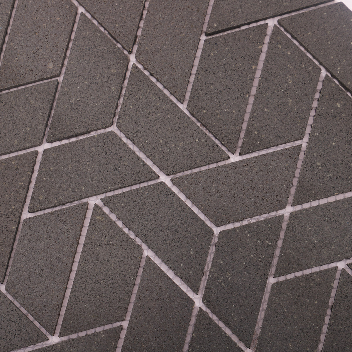 Close-up of black marble mosaic bathroom floor tiles