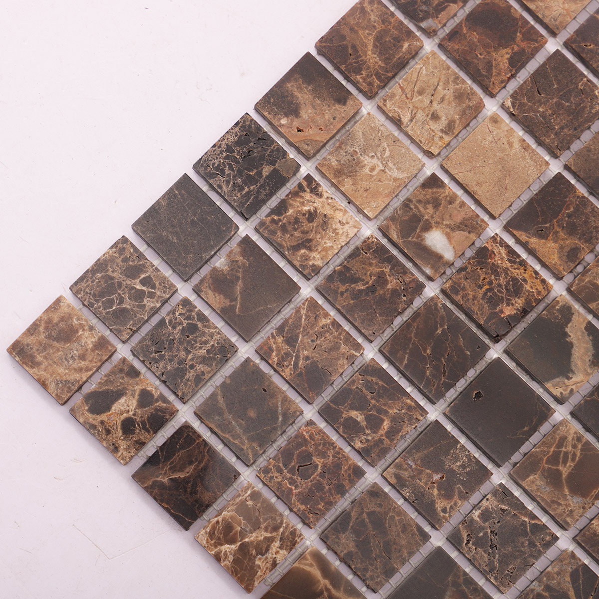 Dark brown mosaic marble tiles close-up