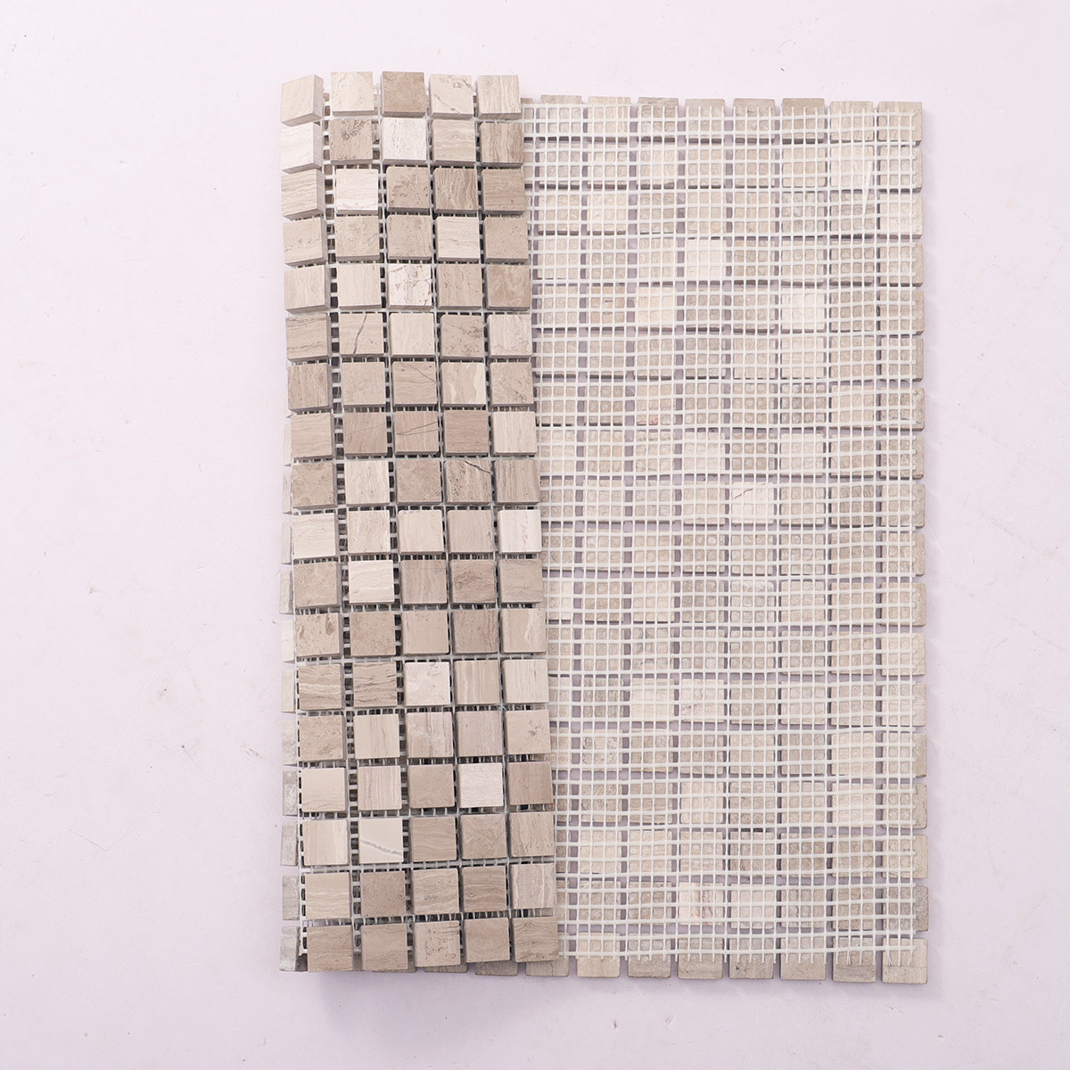 Folded back side of Grigio Imperiale square marble mosaic tiles.