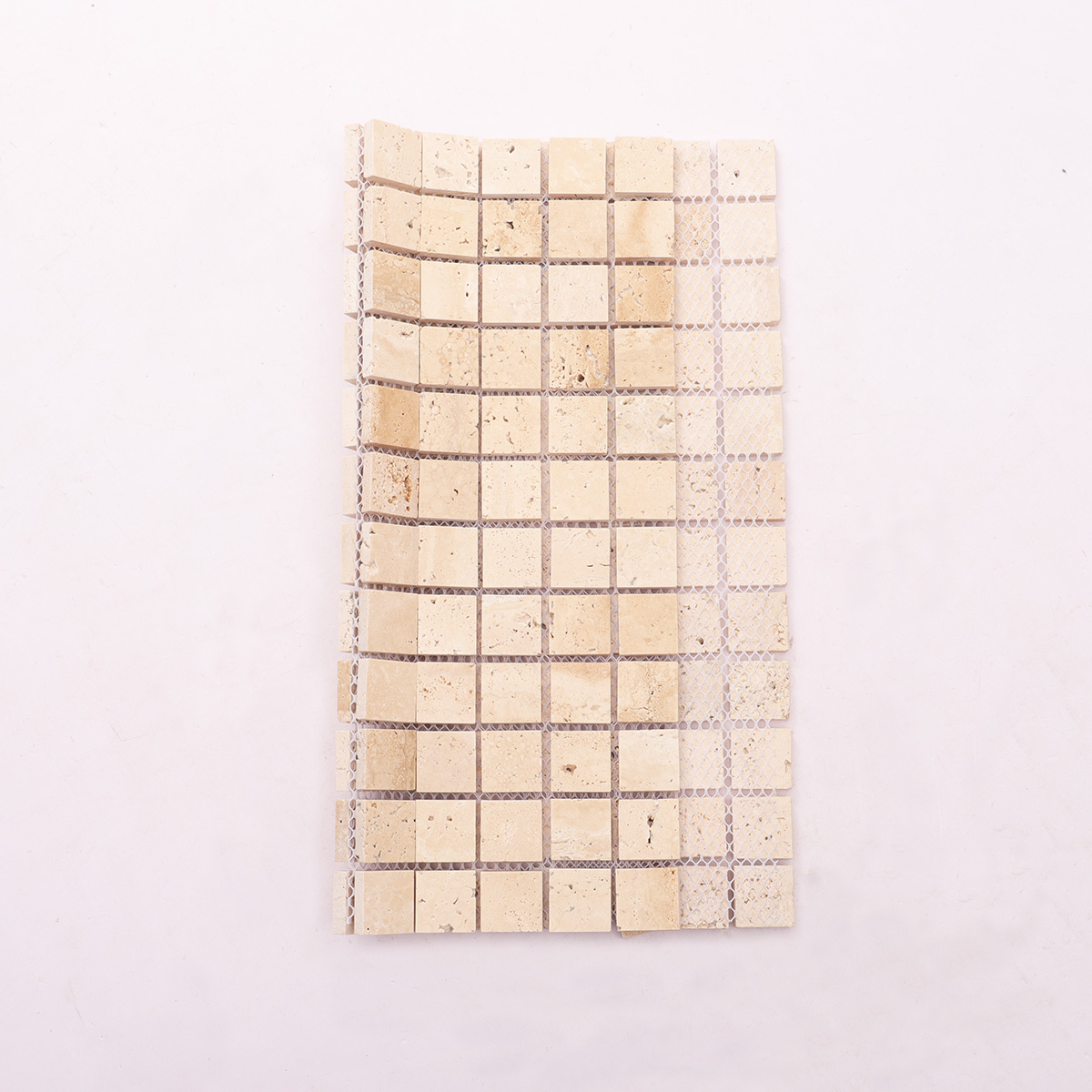 Back side of light honed square mosaic travertine.