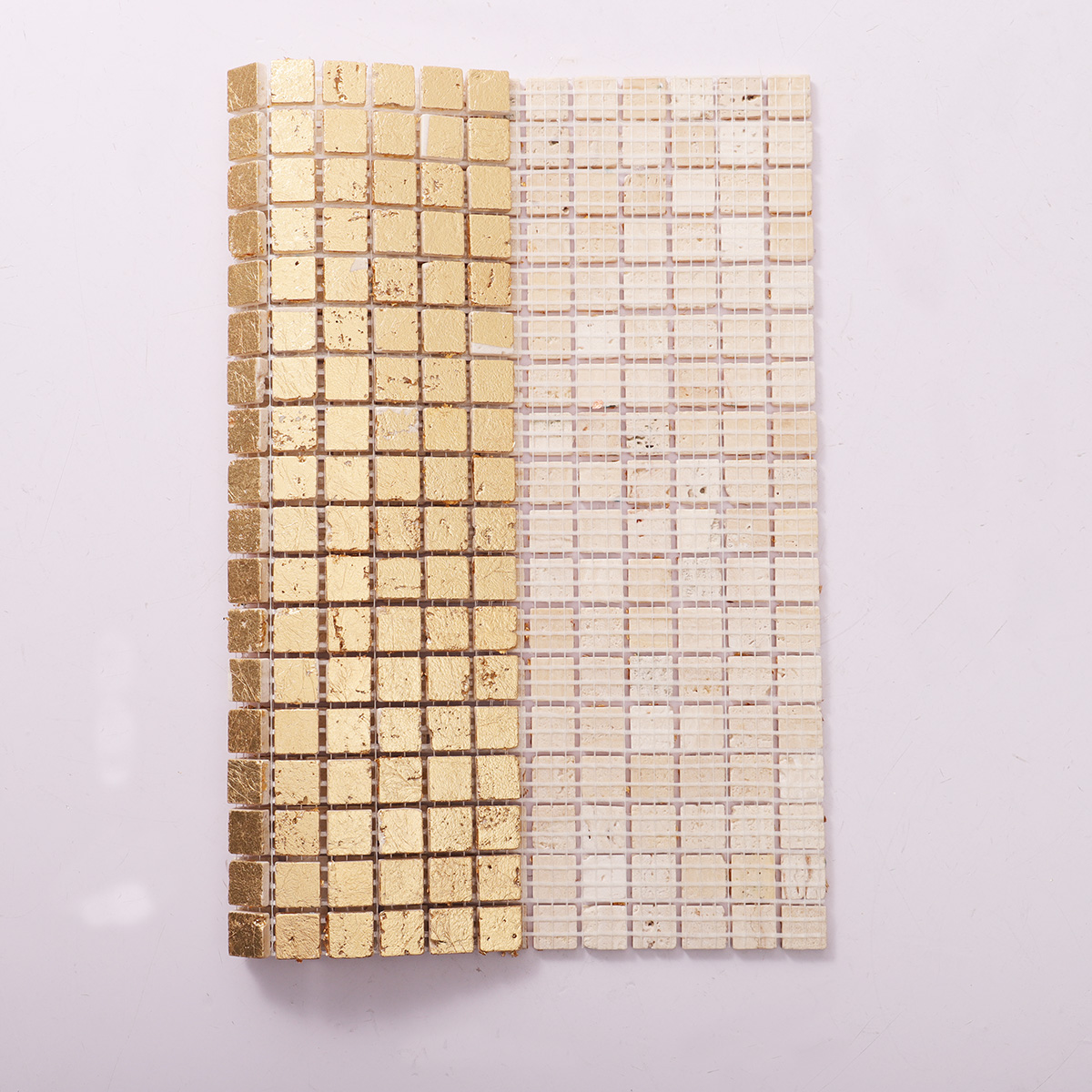 Back side of gold foil square travertine mosaic tiles, folded
