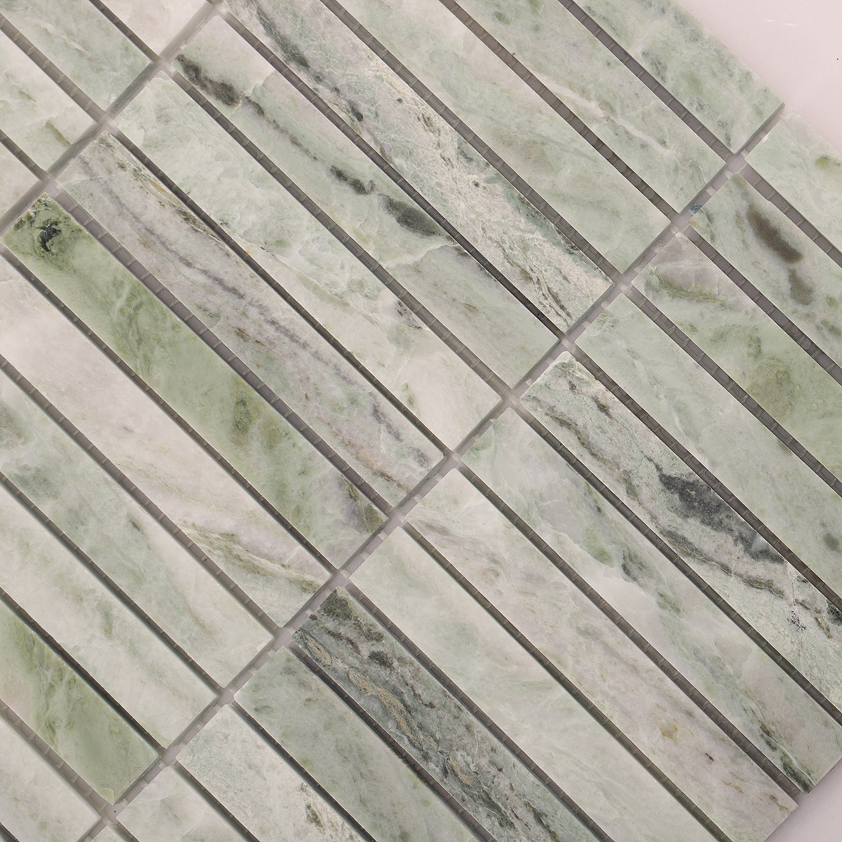 Close-up view of Ming green marble polished mosaic tiles.