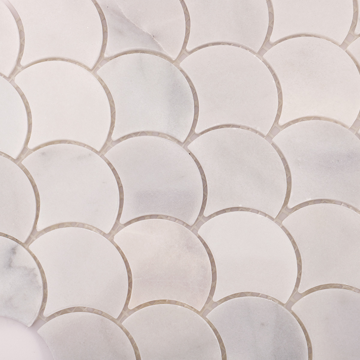 Macro close-up of fish scale white marble polished mosaic tiles.