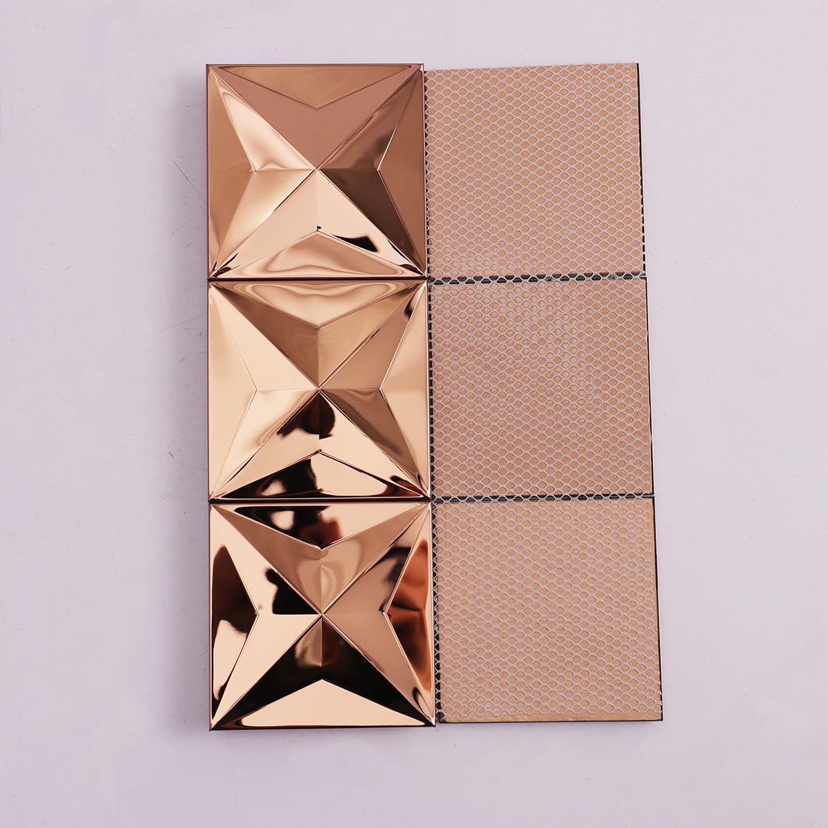 Back side of rose gold 3D stainless steel metal mosaic tiles, folded.