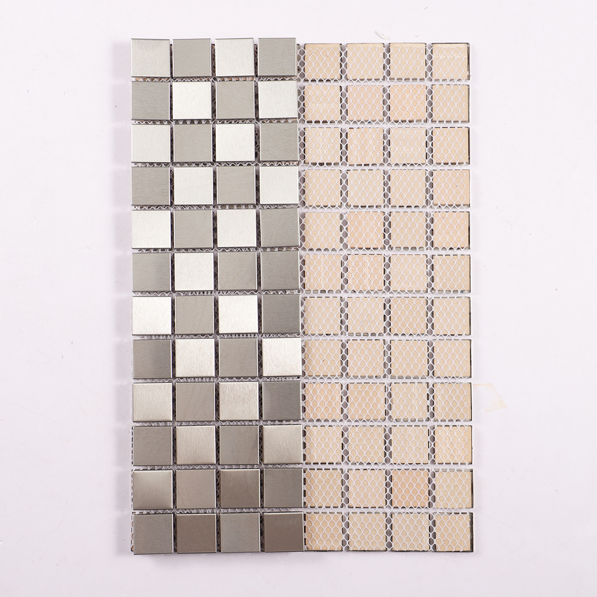 Folded back side of silver brushed stainless steel square mosaic tiles.