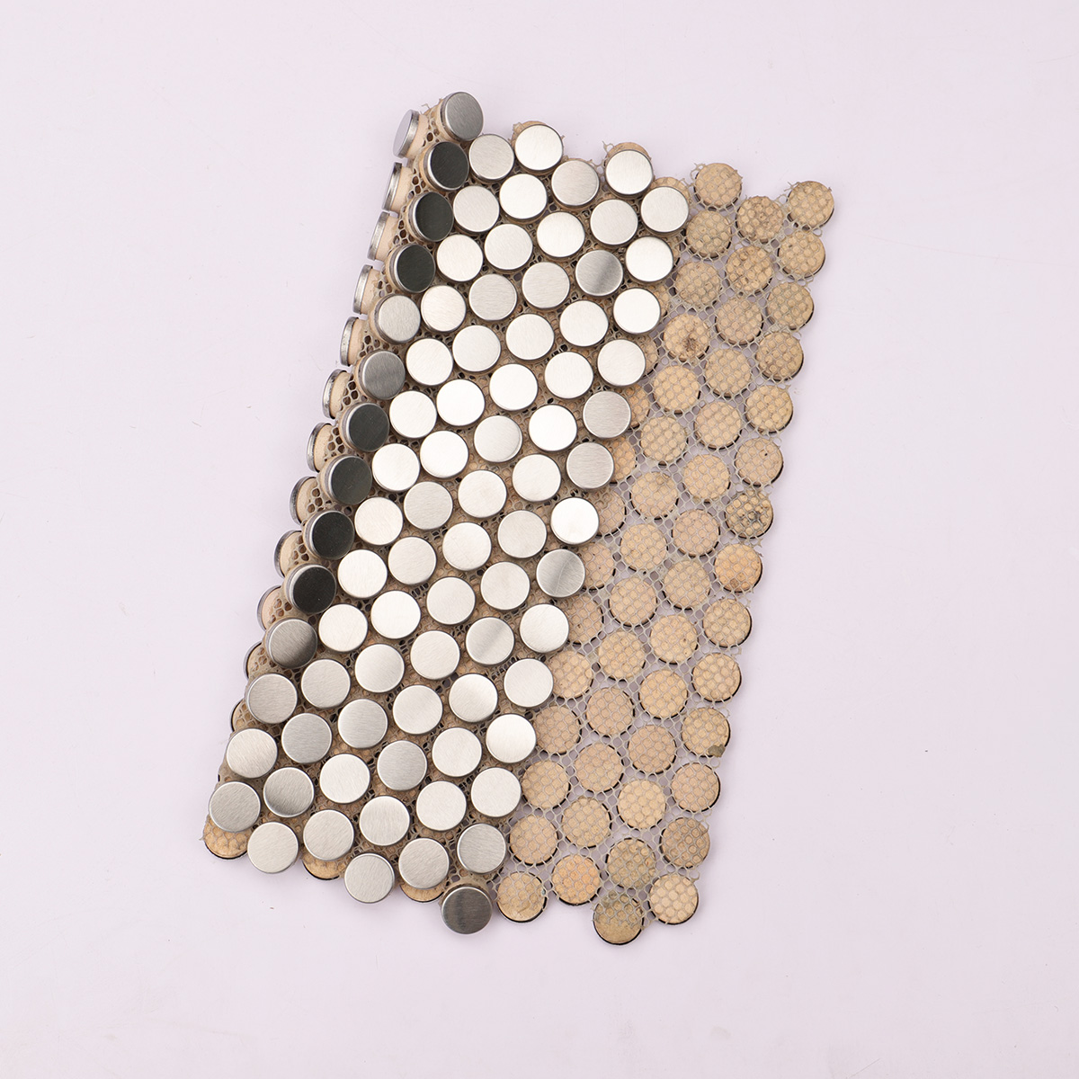Folded back side of brushed silver penny rounds metal mosaic tiles.