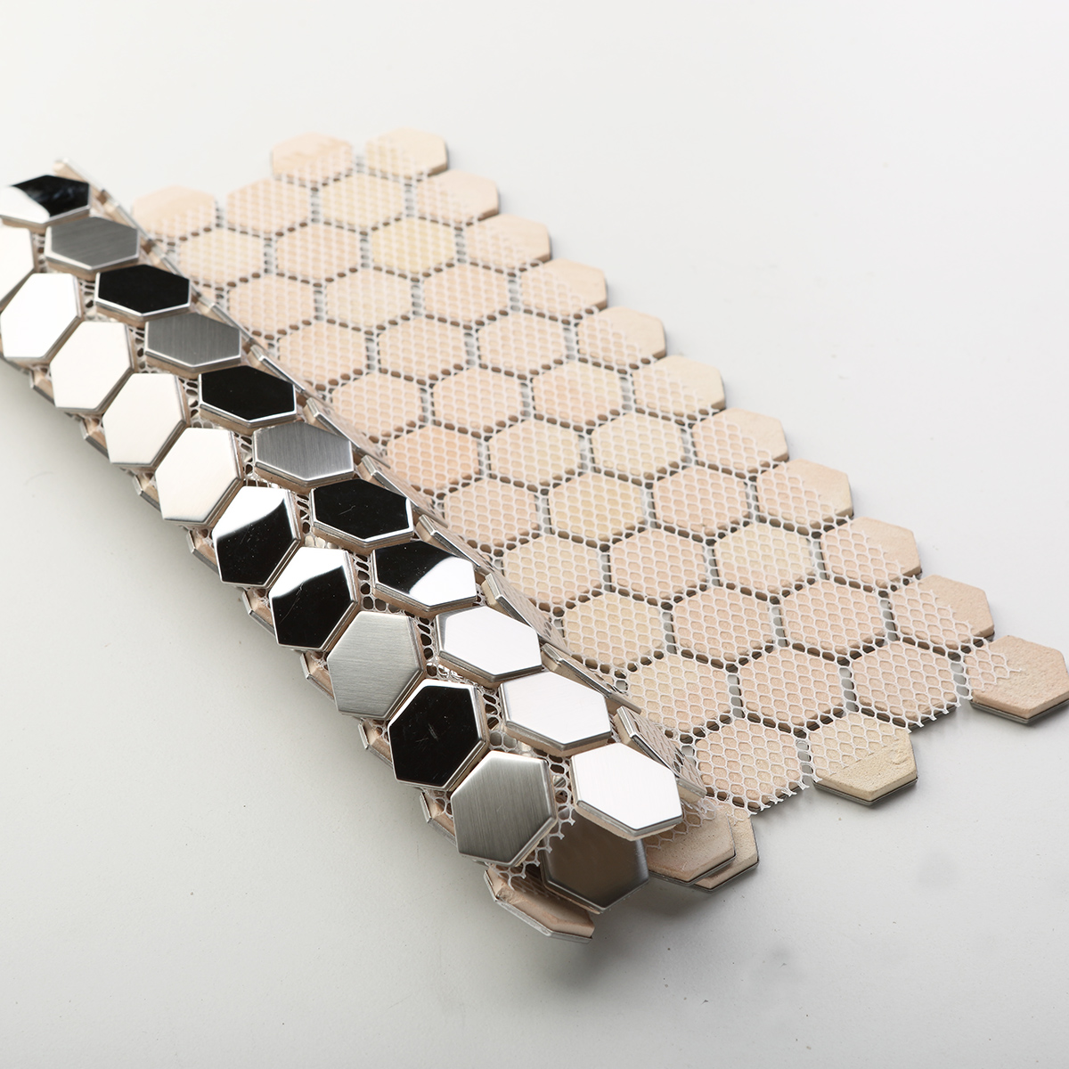 Folded back side of silver hexagon stainless steel mosaic tiles.