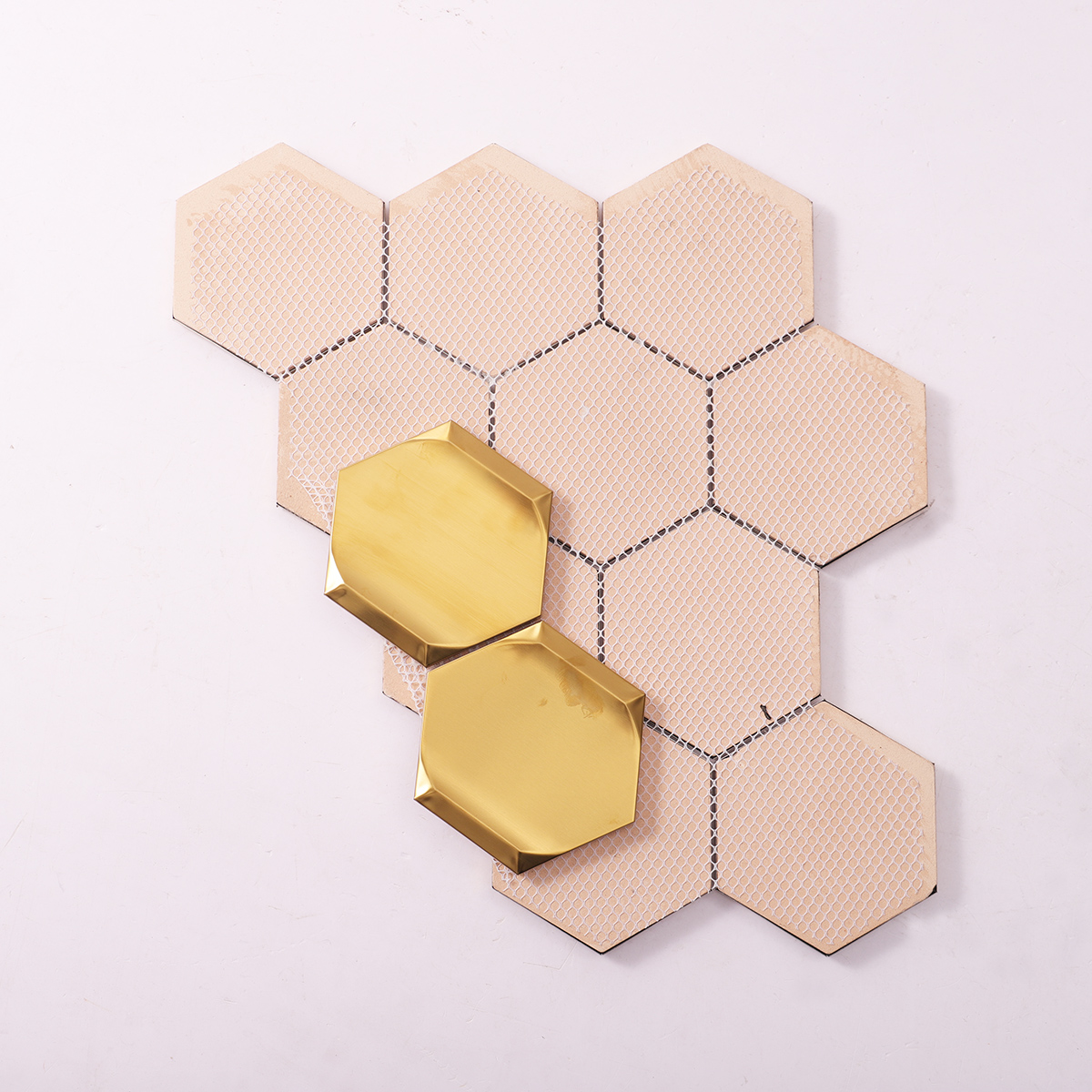 Back side of big hexagon gold 3D stainless steel metal mosaic tiles, folded.